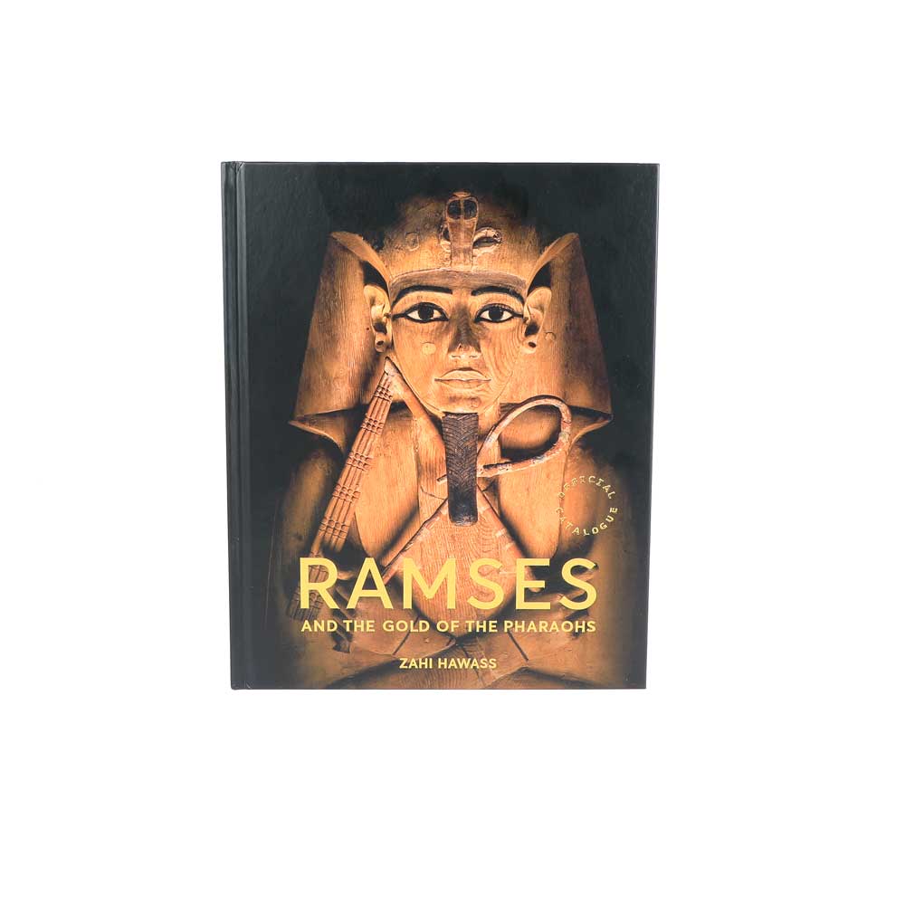Ramses and the gold of the Pharaohs exhibition catalogue on white background