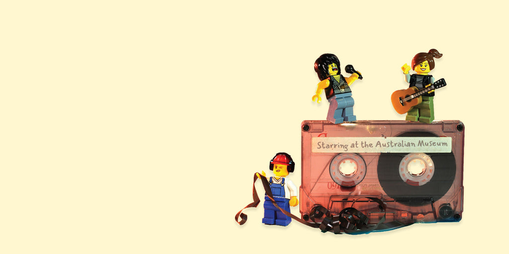 Relics Exhibition minifigs and cassette tape on cream background