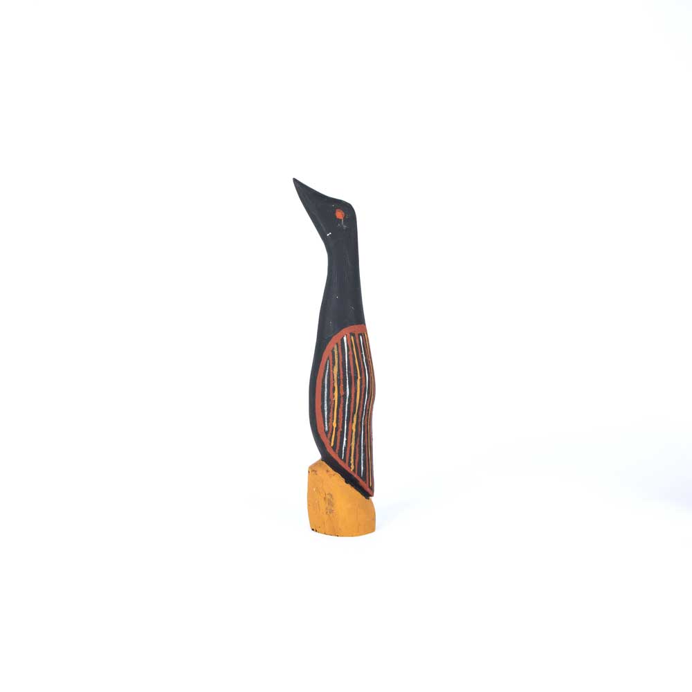 Black cormorant Sculpture, hand carved and painted by Romeo Tipiloura,  Tiwi Design on white background