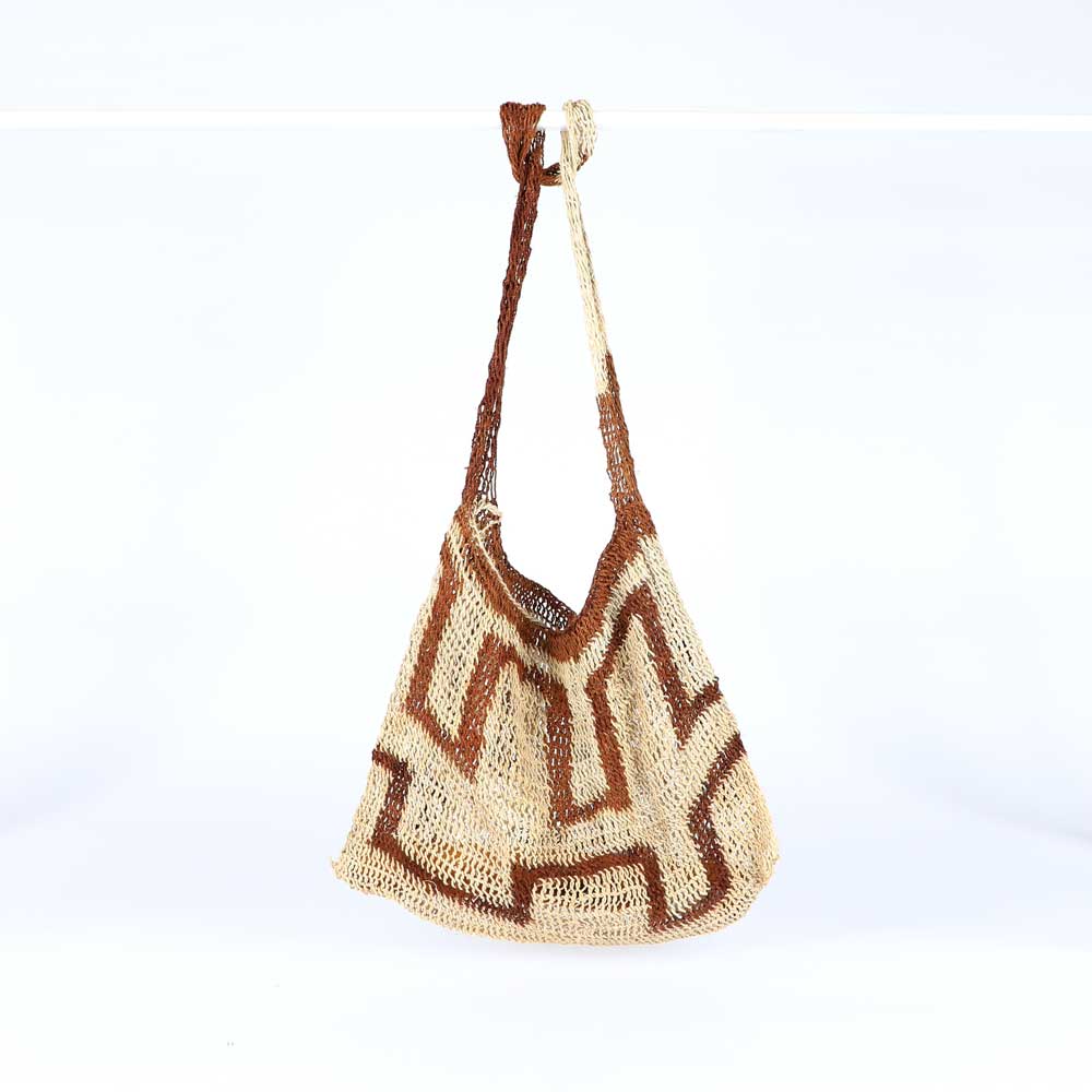 Natural fibre bilum bag on white background