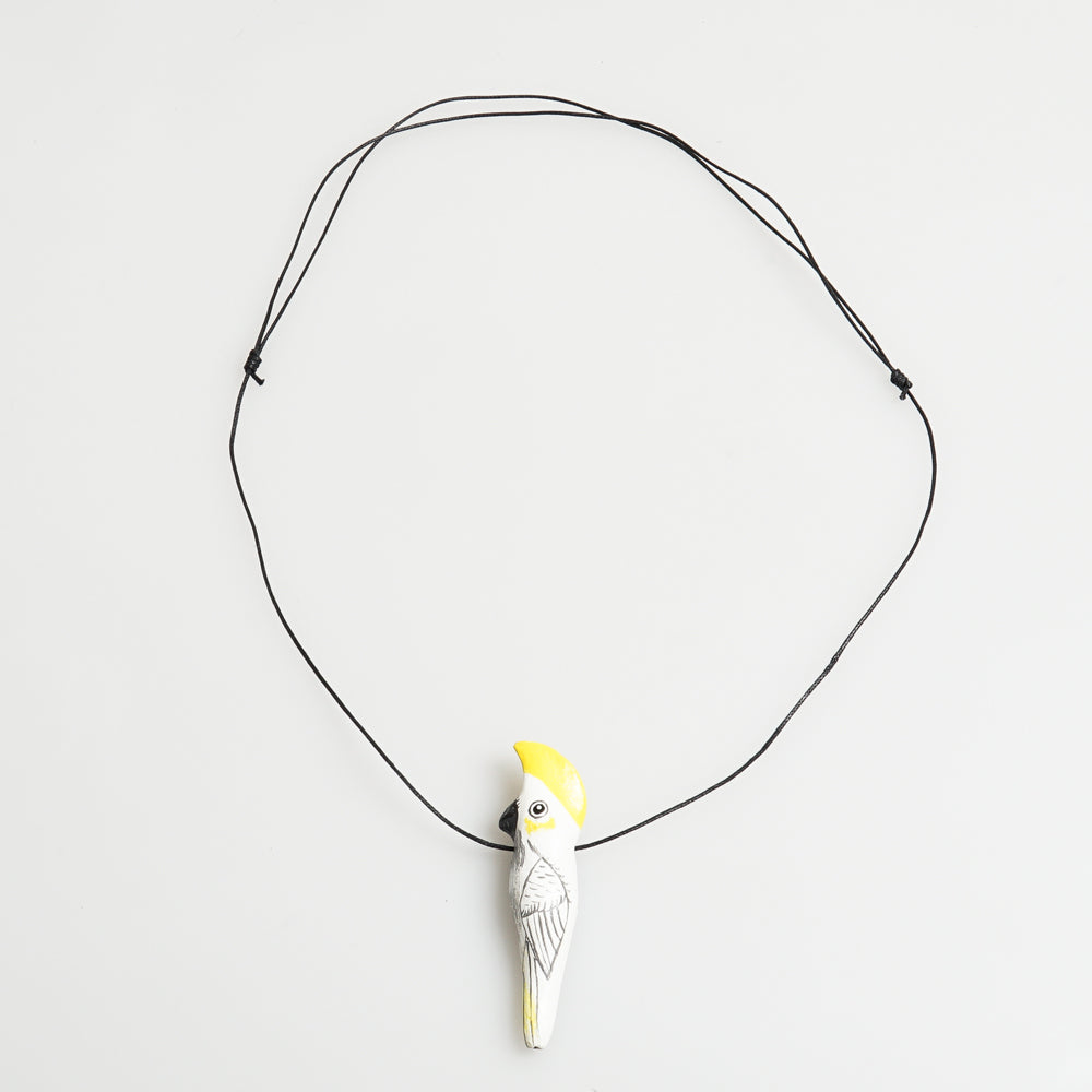 Bird Whistle Necklace hand made hand painted on white background