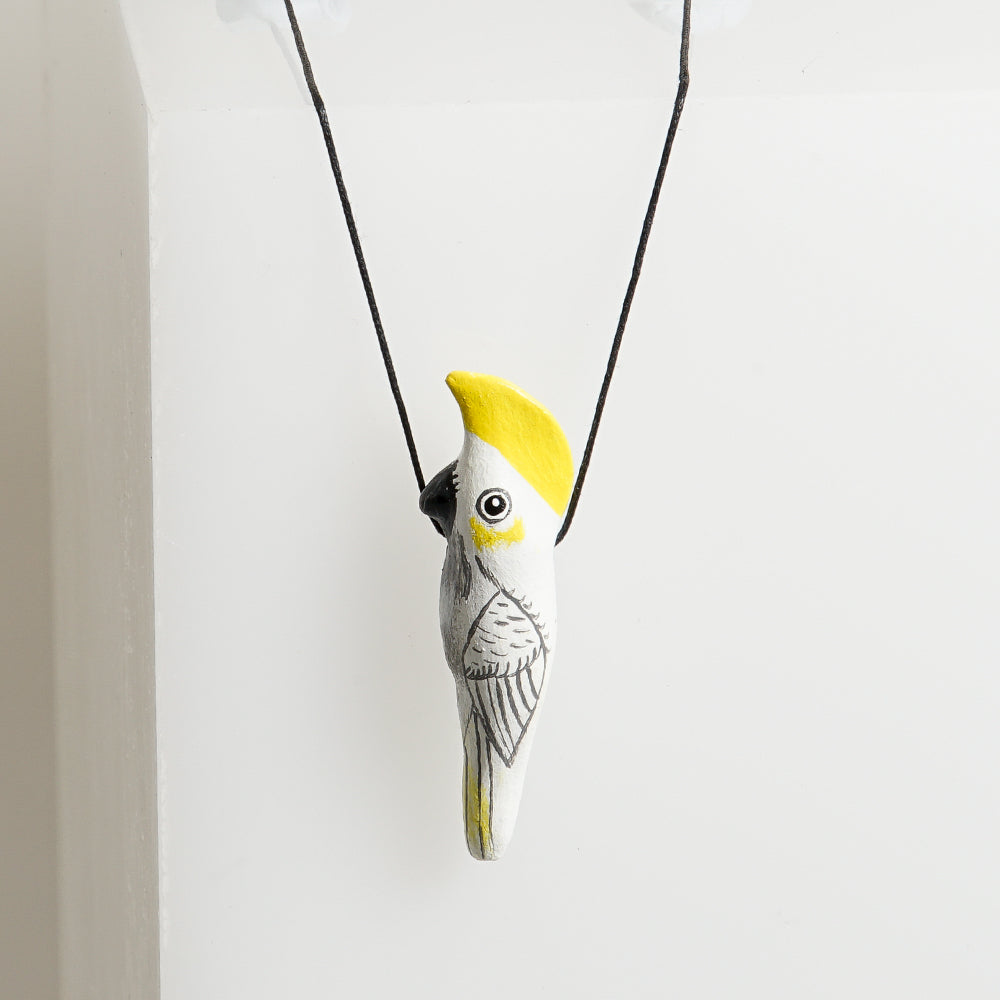 Bird Whistle Necklace hand made hand painted on white background