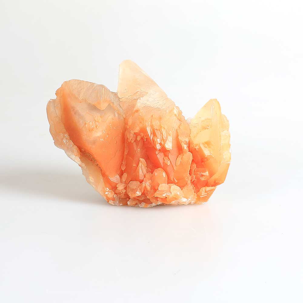 Tangerine Calcite. China, PHotographed against white background. Australian Museum shop online