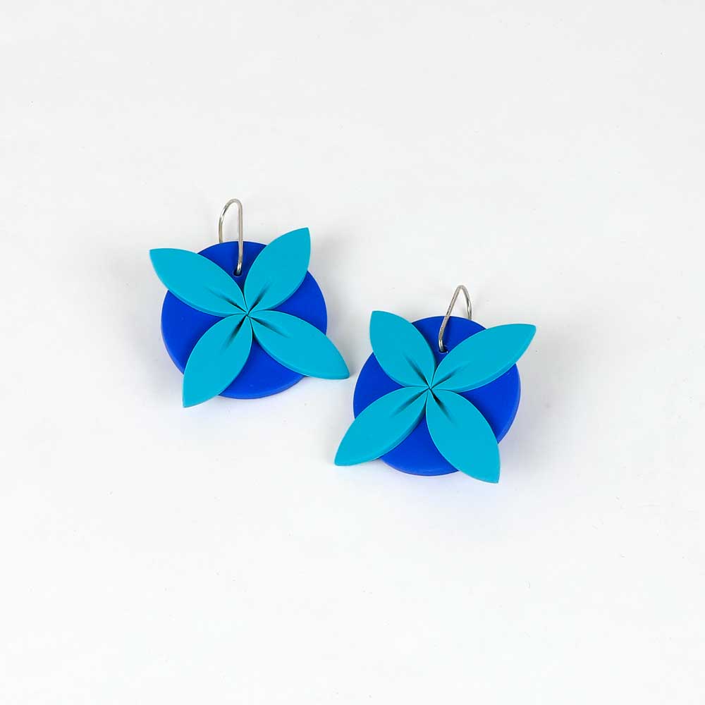 Tipani earrings on white background