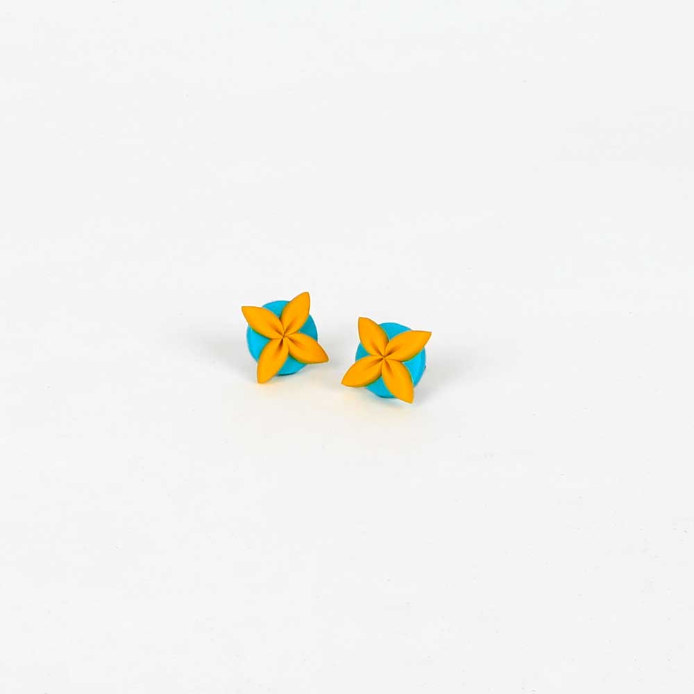 Tipani stud earrings blue yellow on white background