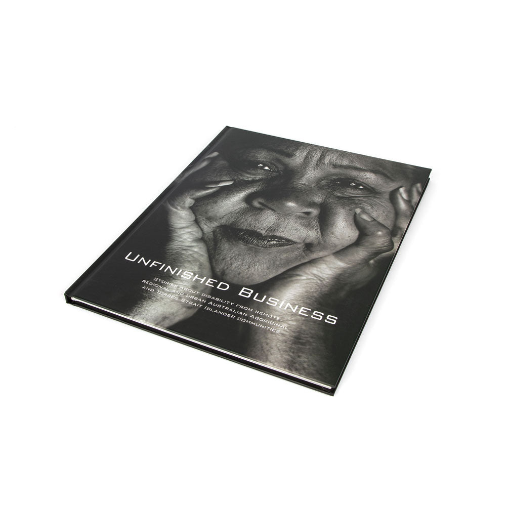 Book titled 'Unfinished Business' on white background