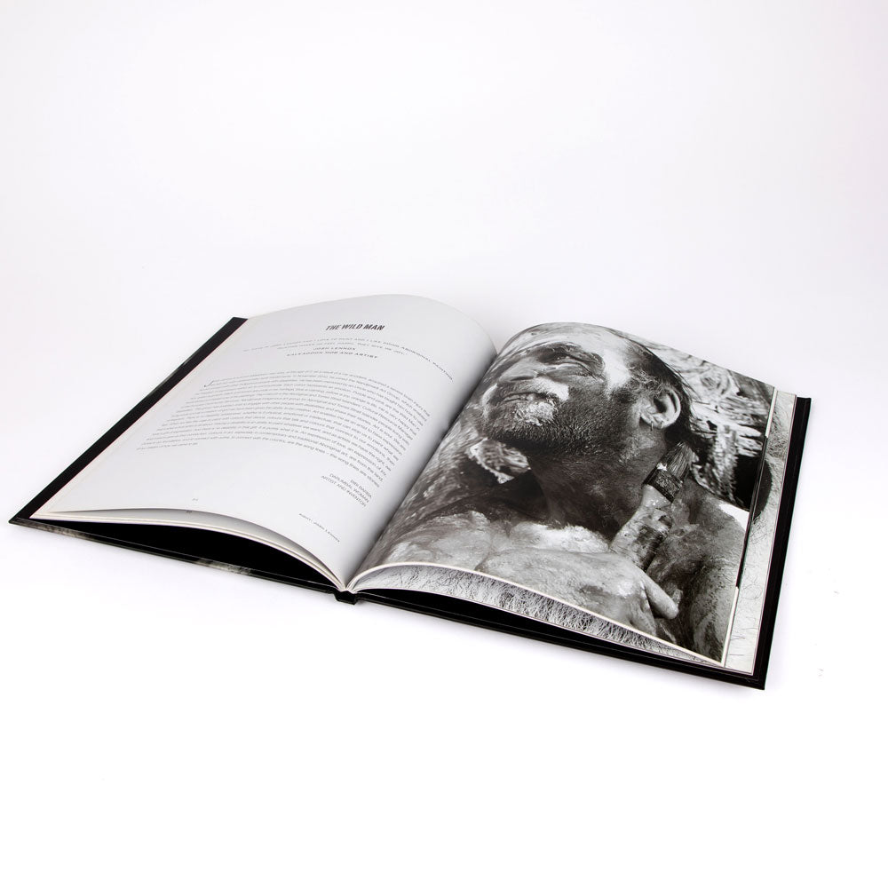 Open book: Unfinished Business with black and white portrait on a white background