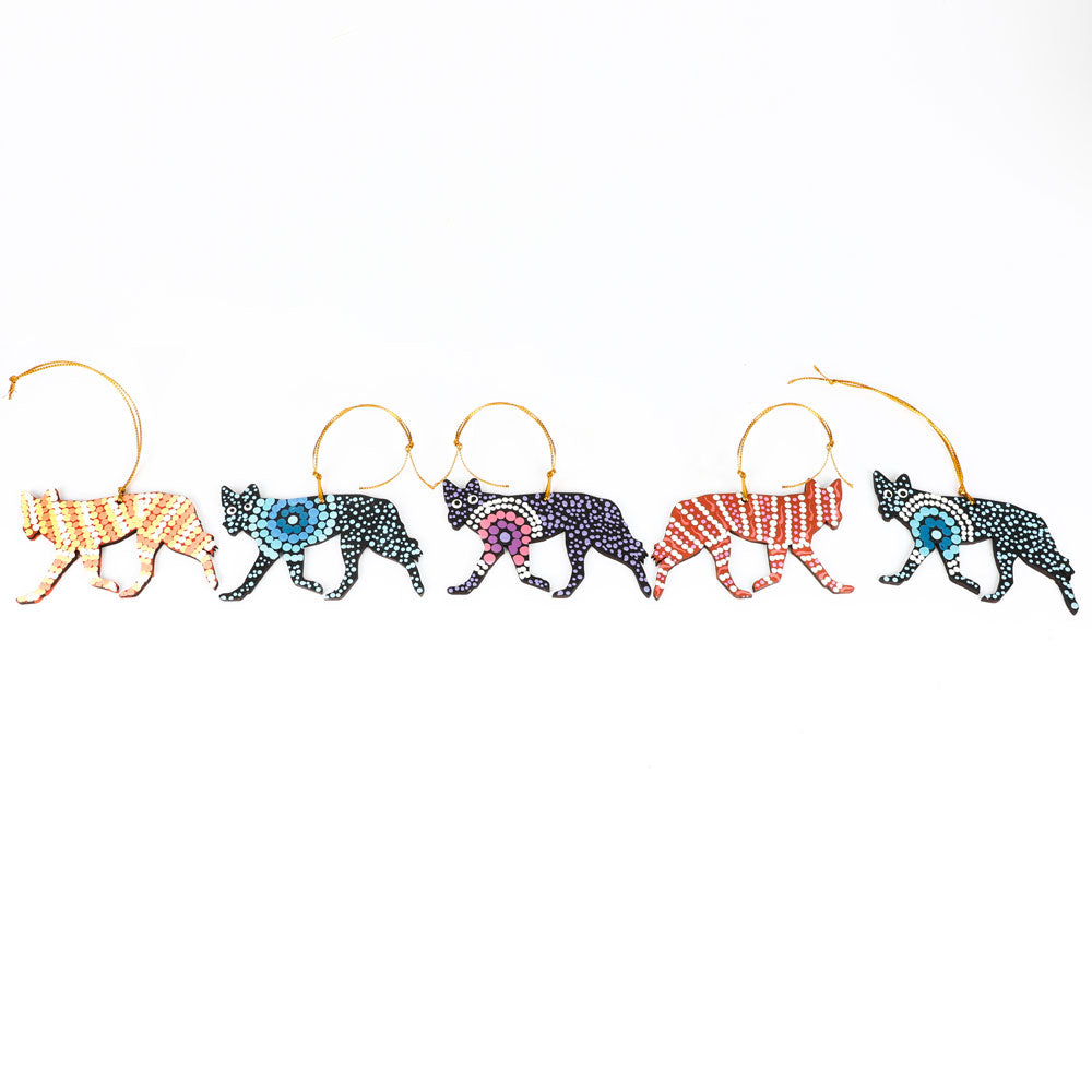 Handpainted desert dog ornaments from Warlukurlangu artists cooperative on white background