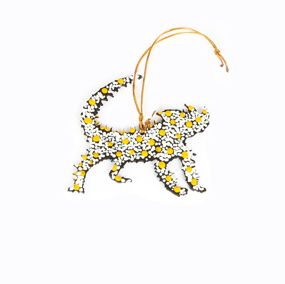 Decorative thorny devil ornament handpainted by Warlukurlangu Artists, on a white background