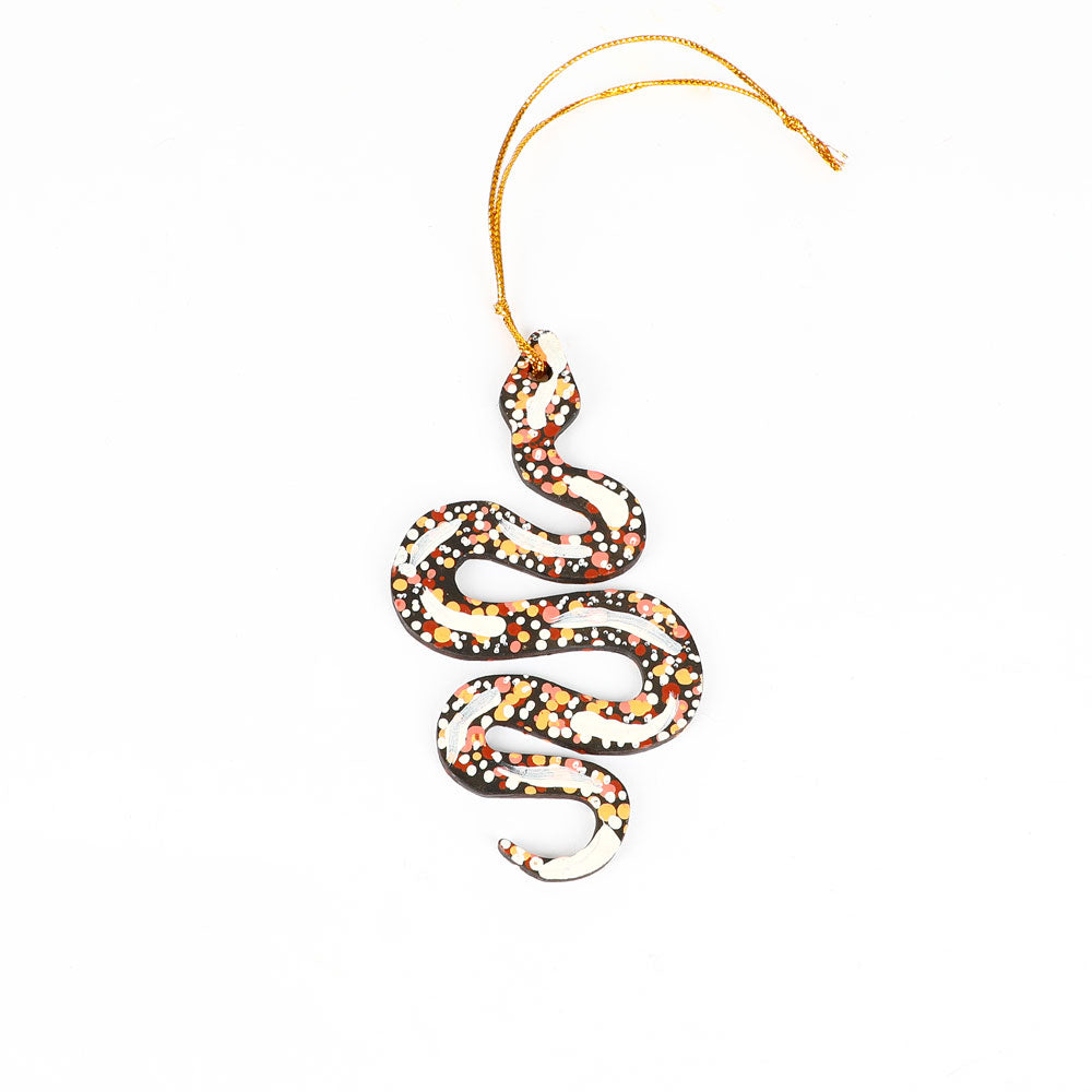Decorative snake ornament handpainted by Warlukurlangu Artists, on a white background