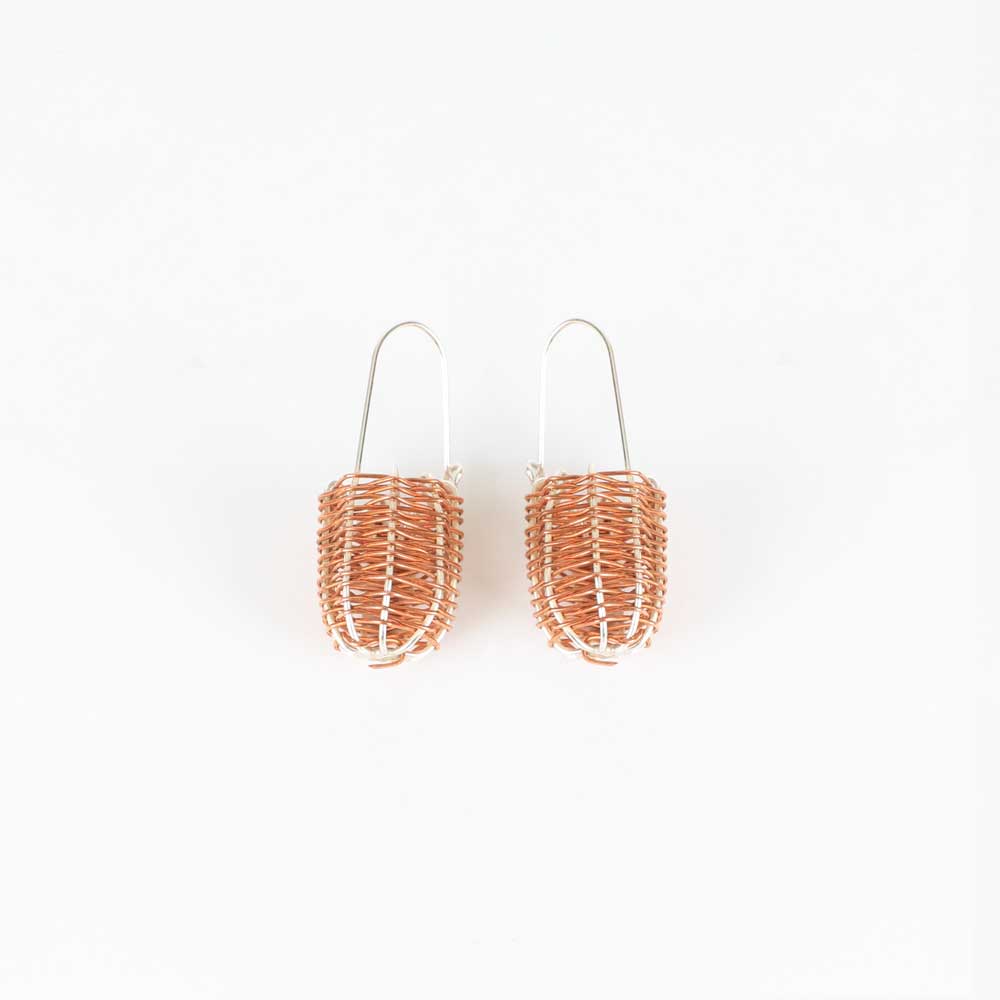 Silver and copper wire dilly bag earrings on white background