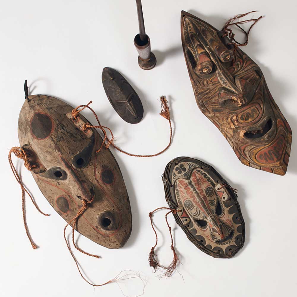 Sepik river traditional carvings photographed on white background. Pacific culture. Australian museum shop online
