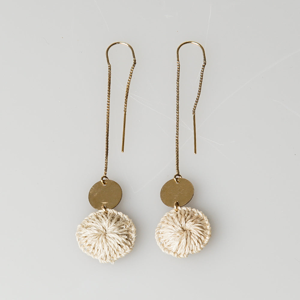 Sterling silver, U-shaped ear threaded earrings, featuring aa gold filled disc and a handwoven bilum fibre disc.