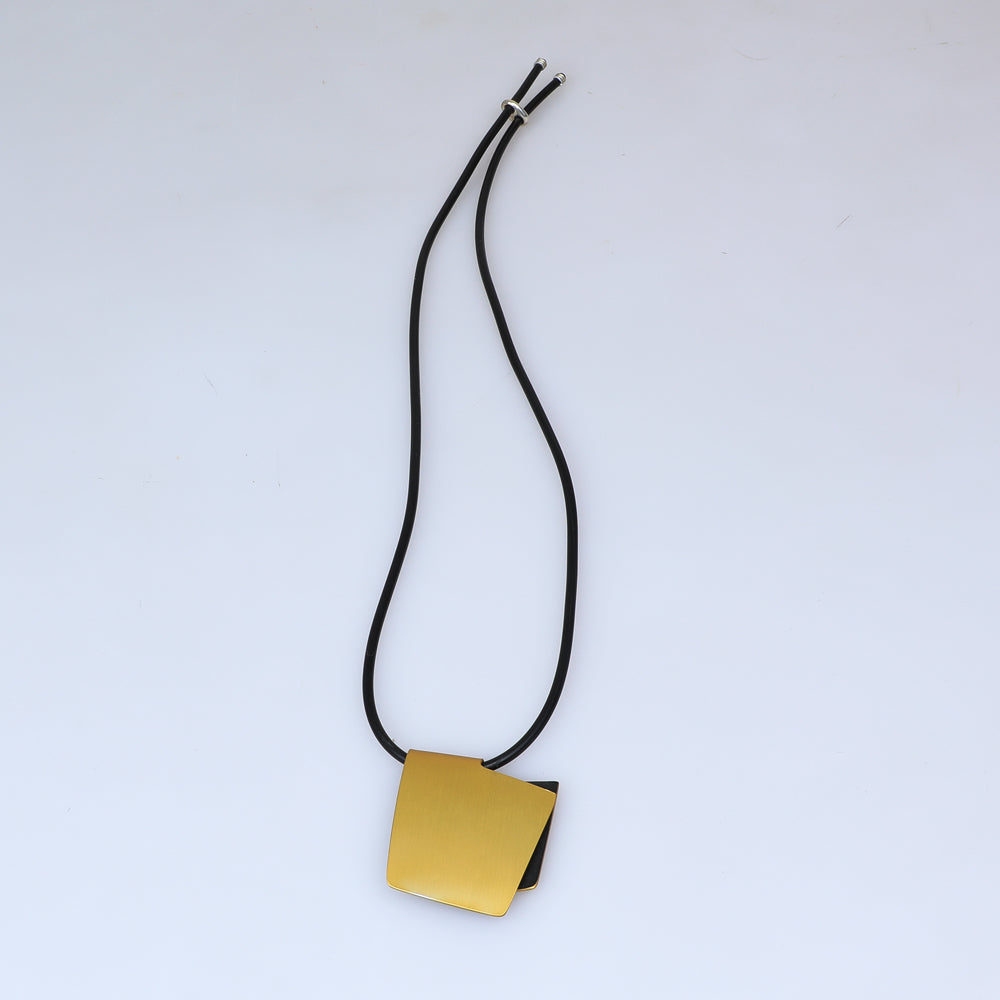 Fink anodised aluminium and stainless steel Neck Piece on white background